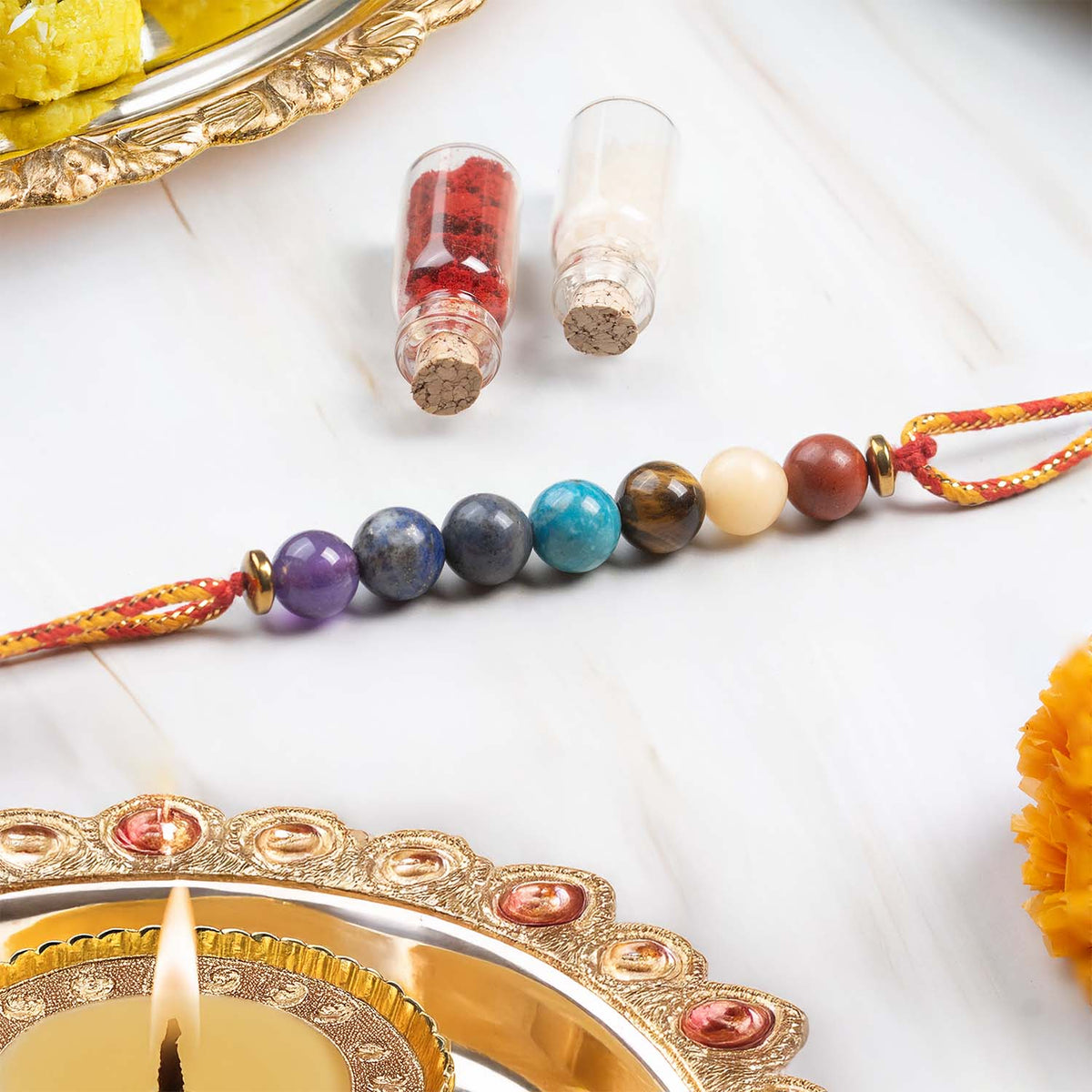 Mesmerize Rakhi Collection – 11 Chakra, Ruby & Spiritual Rakhis for ...